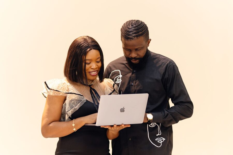 Two consultants reviewing a security assessment together on a laptop