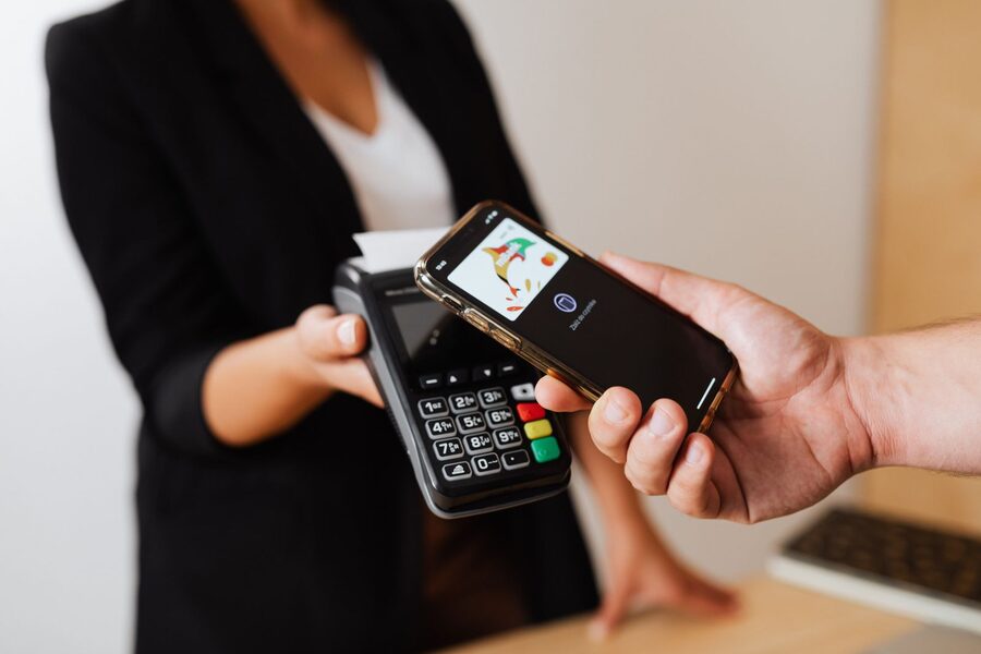 Customer completing a contactless payment at a card terminal